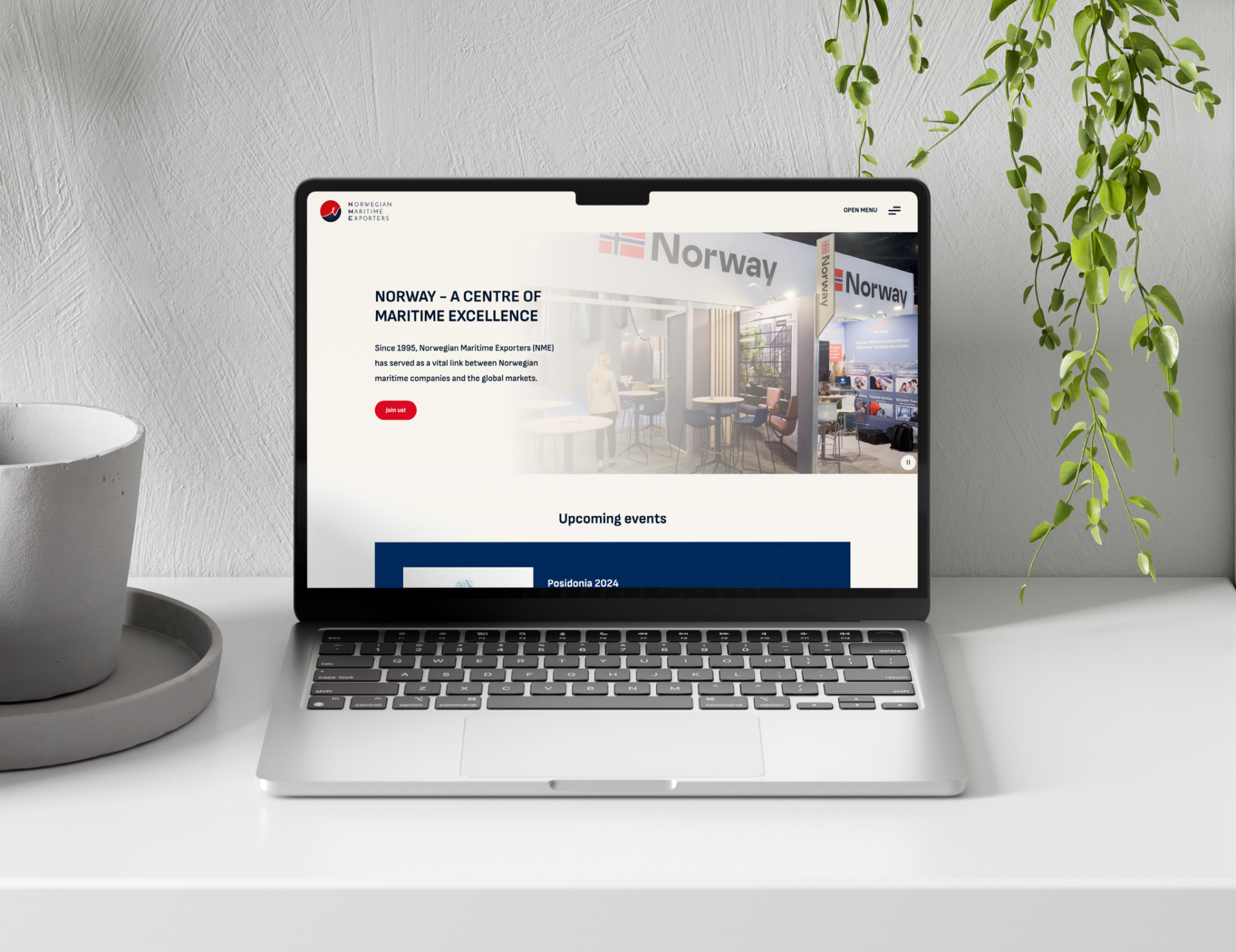 Forsiden til Norwegian Maritime Exporters vist på en laptop