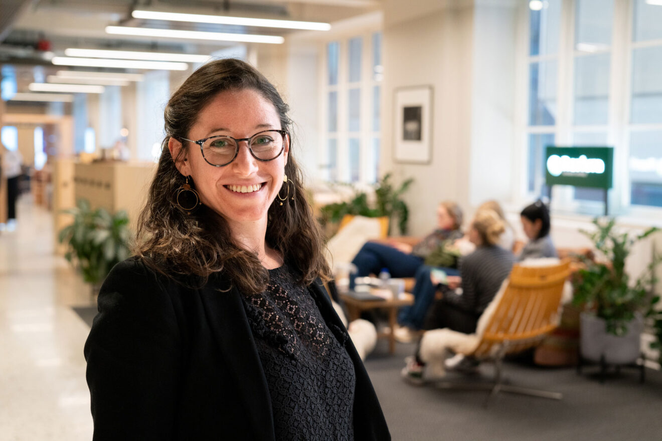 Laura fouilland standing in an office lounge